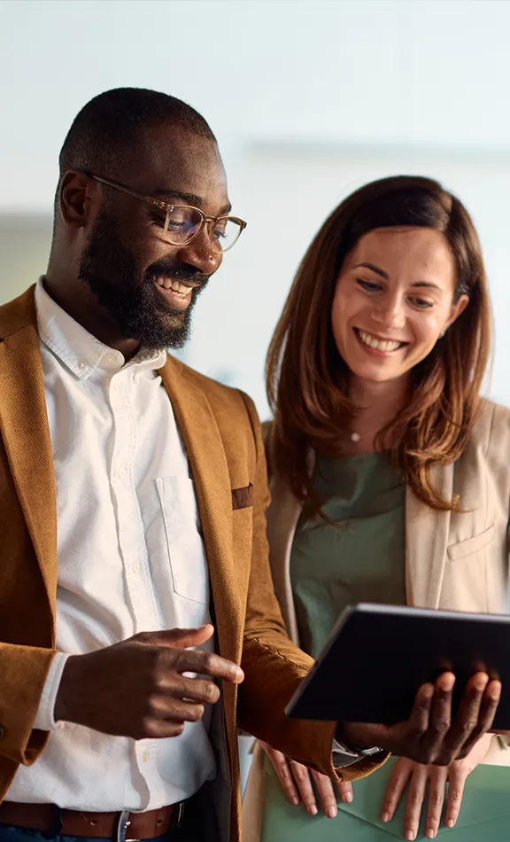 business administration students looking at tablet