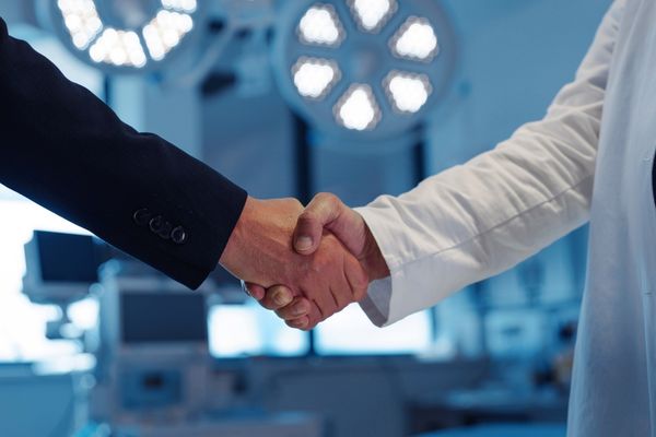 hospitality managers shaking hands