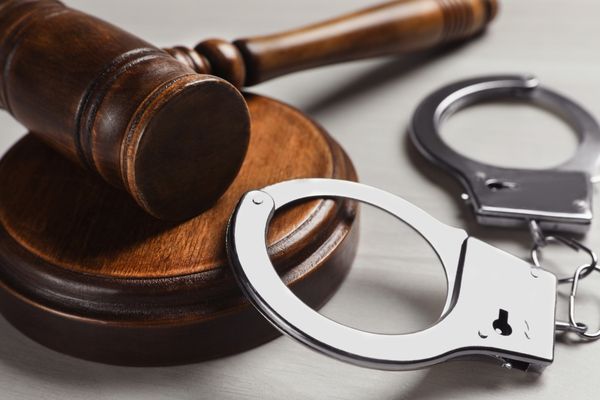 criminal justice handcuffs and mallet