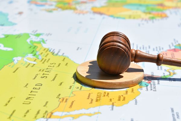 international relations depicted by gavel sitting on map