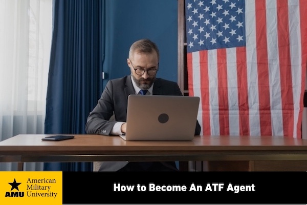 ATF agent working on laptop