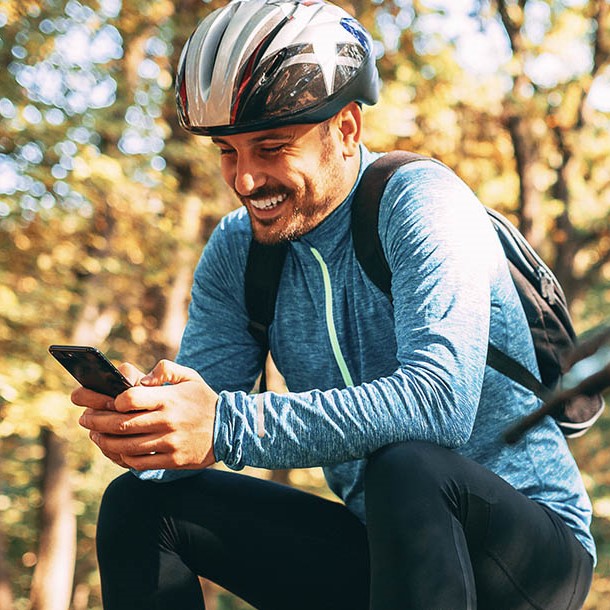 cybercrime essentials professional looking at phone