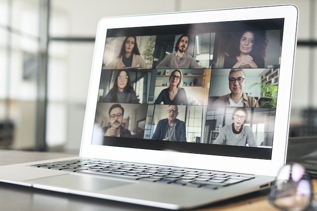 coworkers on virtual meeting on laptop