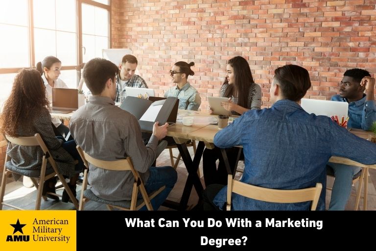 marketing degree graduates holding discussion in office setting