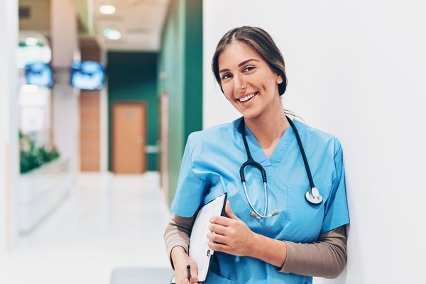 BSN standing in hospital hallway