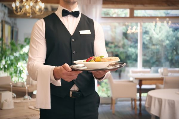 hospitality management professional serving food
